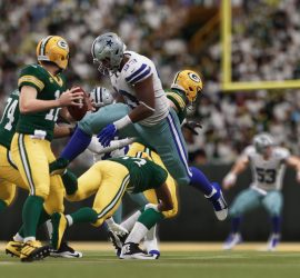 Gerald McCoy leaps over a defender