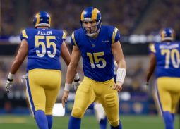 Los Angeles Rams quarterback George Johnson celebrates another touchdown in the end zone.